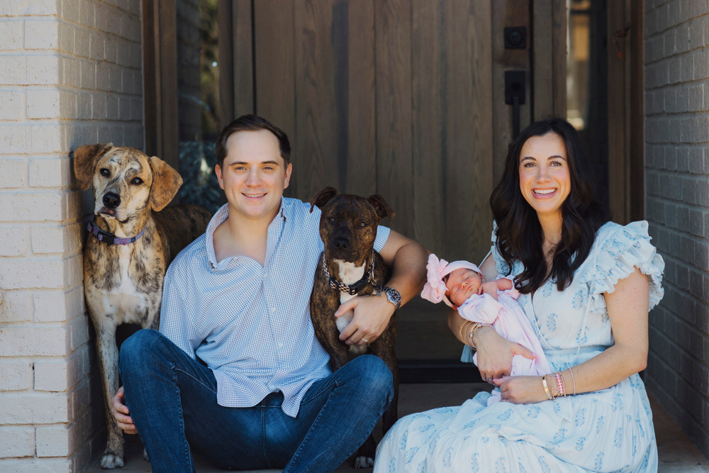 Dr. Ali Rahill with her husband, daughter, and rescue dogs